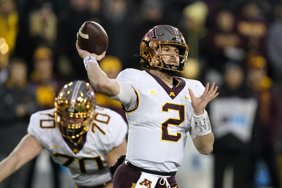 Minnesota quarterback Tanner Morgan (2) throws a pass during the second half of an NCAA college football game against Iowa, Saturday, Nov. 13, 2021, in Iowa City, Iowa. Iowa won 27-22. (AP Photo/Charlie Neibergall)