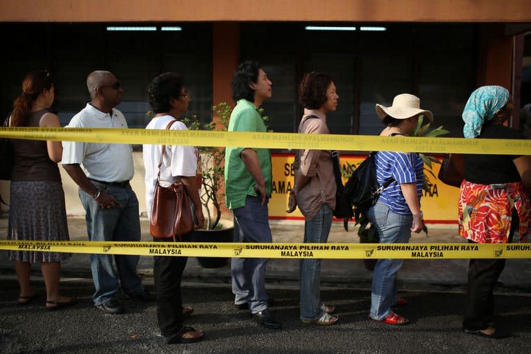 Malaysians queue to cast their votes during the country's 13th general elections in Kuala Lumpur on May 5, 2013. Voters across the country complained after the vote that indelible ink, touted by Prime Minister Najib Razak as the cornerstone of his pledge of free and fair elections, was easily washed off