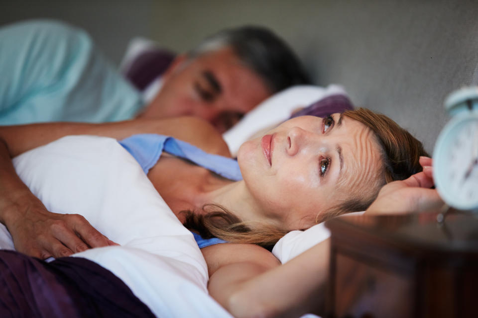 Couple In Bed With Wife Suffering From Insomnia Late At Night