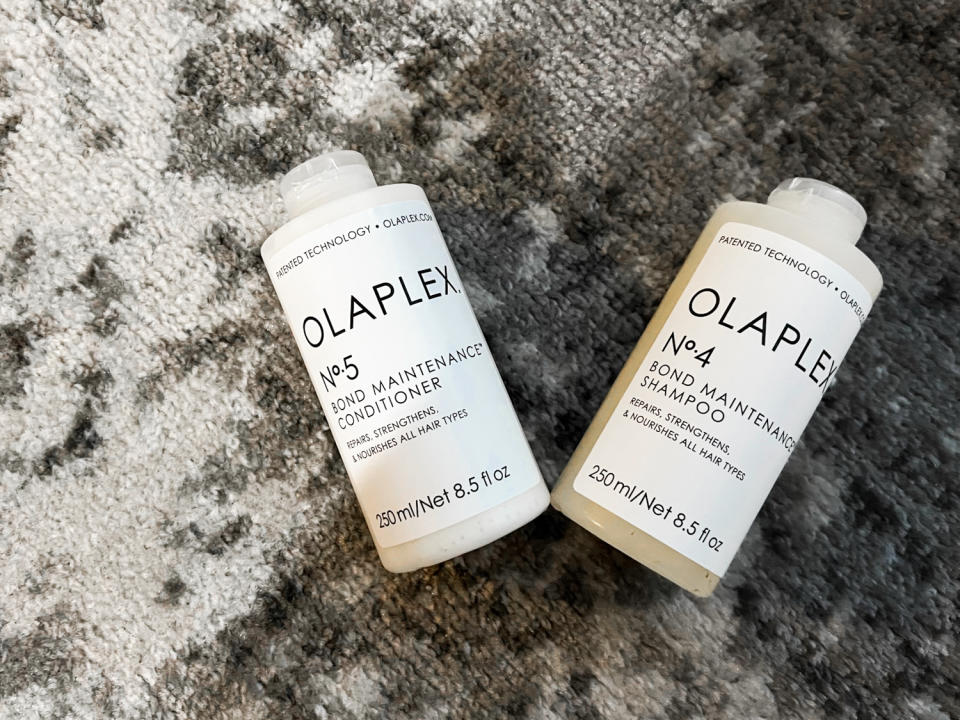 the new olaplex shampoo and conditioner i got laying on my rug