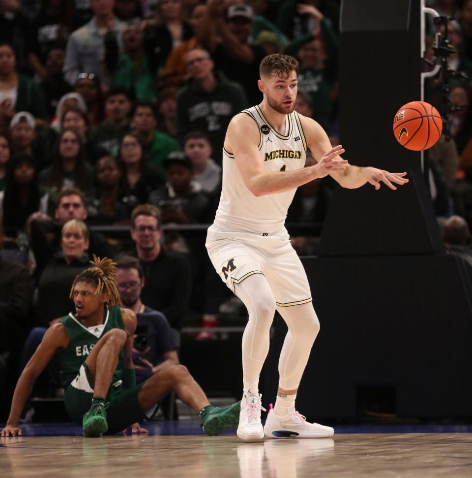 Michigan center Hunter Dickinson rebounds against the Eastern Michigan during the second half of U-M's 88-83 win on Friday, Nov. 9, 2022, at Little Caesars Arena.