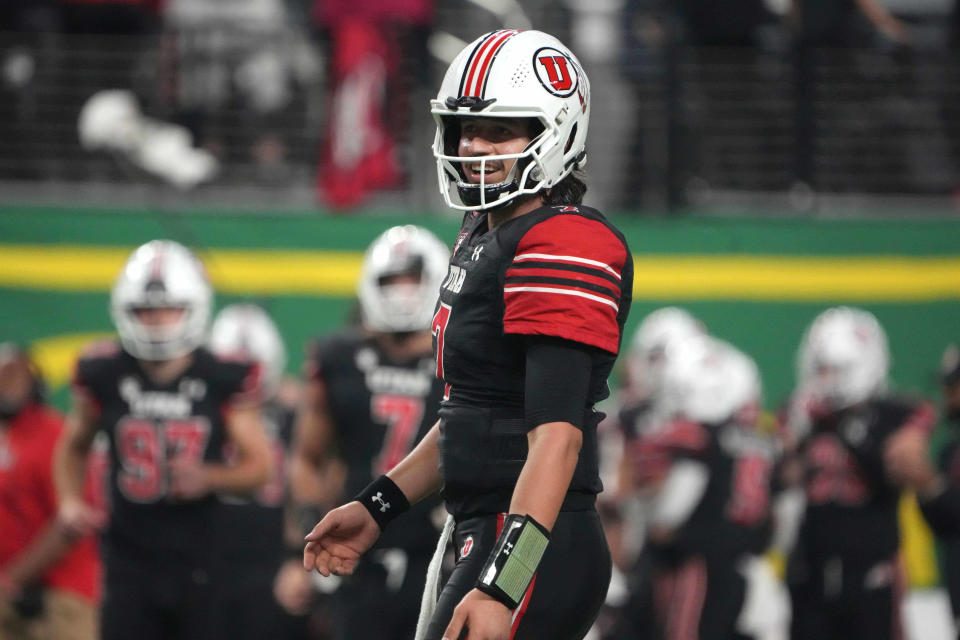 Dec. 3, 2021; Las Vegas, Nevada; Utah Utes quarterback <a class="link " href="https://sports.yahoo.com/ncaaf/players/286620" data-i13n="sec:content-canvas;subsec:anchor_text;elm:context_link" data-ylk="slk:Cameron Rising;sec:content-canvas;subsec:anchor_text;elm:context_link;itc:0">Cameron Rising</a> (7) celebrates against the <a class="link " href="https://sports.yahoo.com/ncaaf/teams/oregon/" data-i13n="sec:content-canvas;subsec:anchor_text;elm:context_link" data-ylk="slk:Oregon Ducks;sec:content-canvas;subsec:anchor_text;elm:context_link;itc:0">Oregon Ducks</a> in the second half during the 2021 Pac-12 Championship Game at Allegiant Stadium. Utah defeated Oregon 38-10. Kirby Lee-USA TODAY Sports