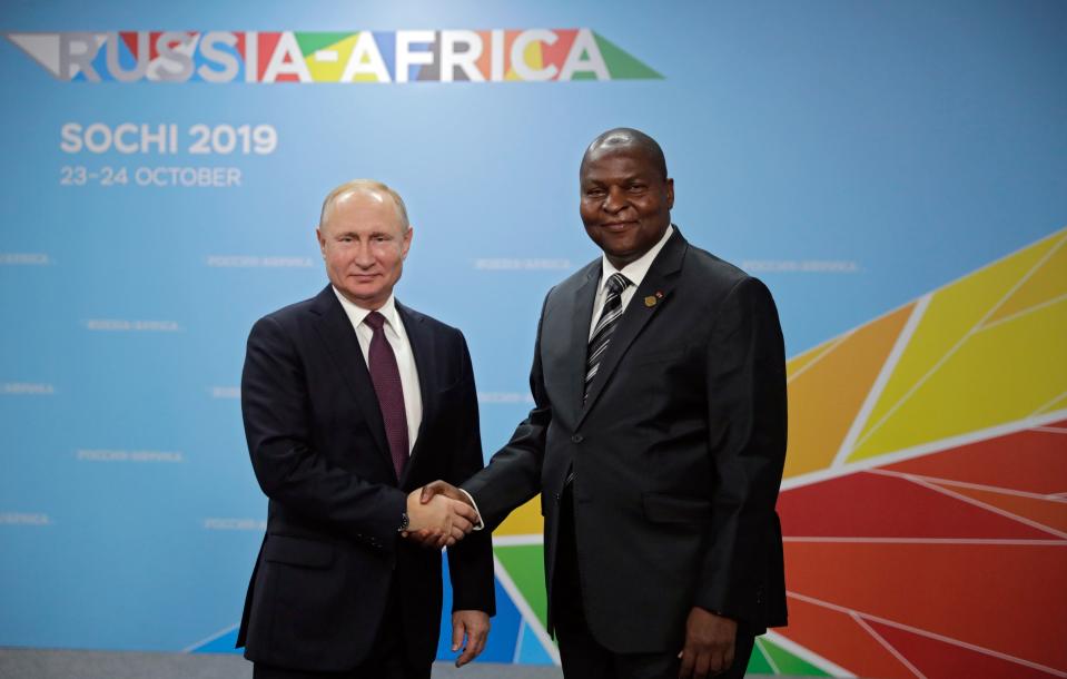 Russian President Vladimir Putin, left, and President of the Central African Republic Faustin Archange Touadera pose for a photo during their meeting on the sideline of Russia-Africa summit in the Black Sea resort of Sochi, Russia, Wednesday, Oct. 23, 2019. (Mikhail Metzel, Sputnik, Kremlin Pool Photo via AP)