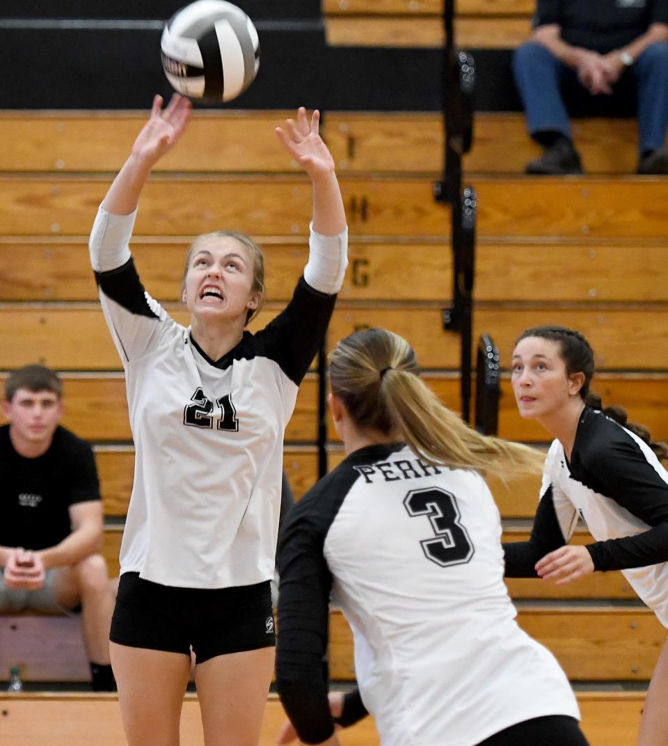 Perry's Sarah Mohr sets the ball during Tuesday's match against Green.