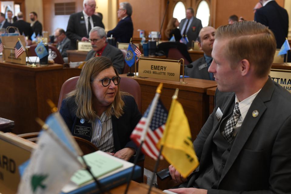 Representative Linda Duba talks to another legislator before the State of the State address on Tuesday, Jan. 9, 2024 at South Dakota State Capitol in Pierre.