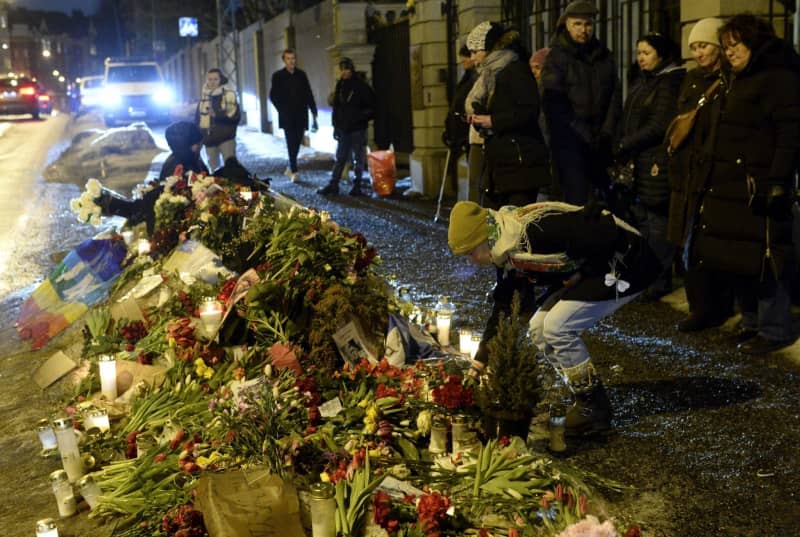 People place flowers and tributes outside the Russian Embassy on the day of the burial of the Russian opposition figure Alexei Navalny in Helsinki. Mikko Stig/Lehtikuva/dpa