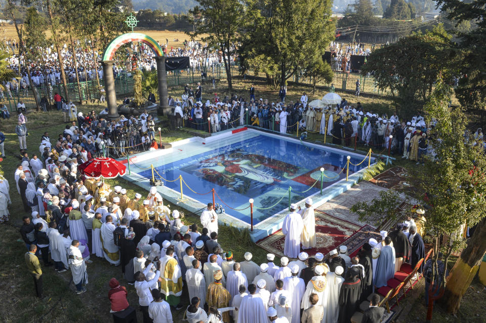 Christians from the Ethiopian Orthodox church celebrate the annual festival of Timkat, or Epiphany, marking the baptism of Jesus Christ in the River Jordan, in the capital Addis Ababa, Ethiopia Monday, Jan. 20, 2020. During Timkat celebrations elsewhere in the country, in the city of Gondar, at least three people are dead after a wooden stand erected for the event collapsed on Monday, according to a hospital source. (AP Photo)