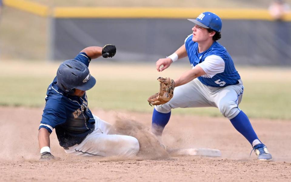 Bald Eagle Area’s Camron Watkins safely steals second as McConnnellsburg’s Gavin Fowler makes the catch during the first round game of the PIAA class 2A baseball playoffs on Monday, June 5, 2023.