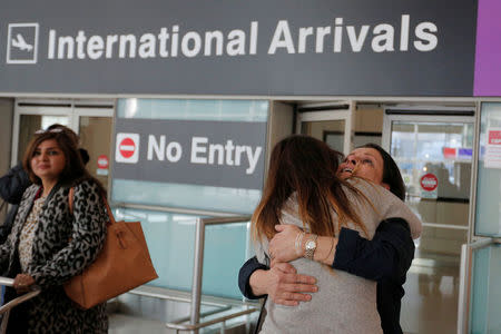 Shanez Tabarsi is greeted by her daughter Negin after traveling to the U.S. from Iran following a federal court's temporary stay of President Trump's executive order travel ban at Logan Airport in Boston. REUTERS/Brian Snyder