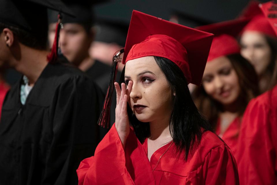 Alexia Deck wipes away tears during the District 70 Online school commencement ceremony at Memorial Hall on Wednesday, May 25, 2022.