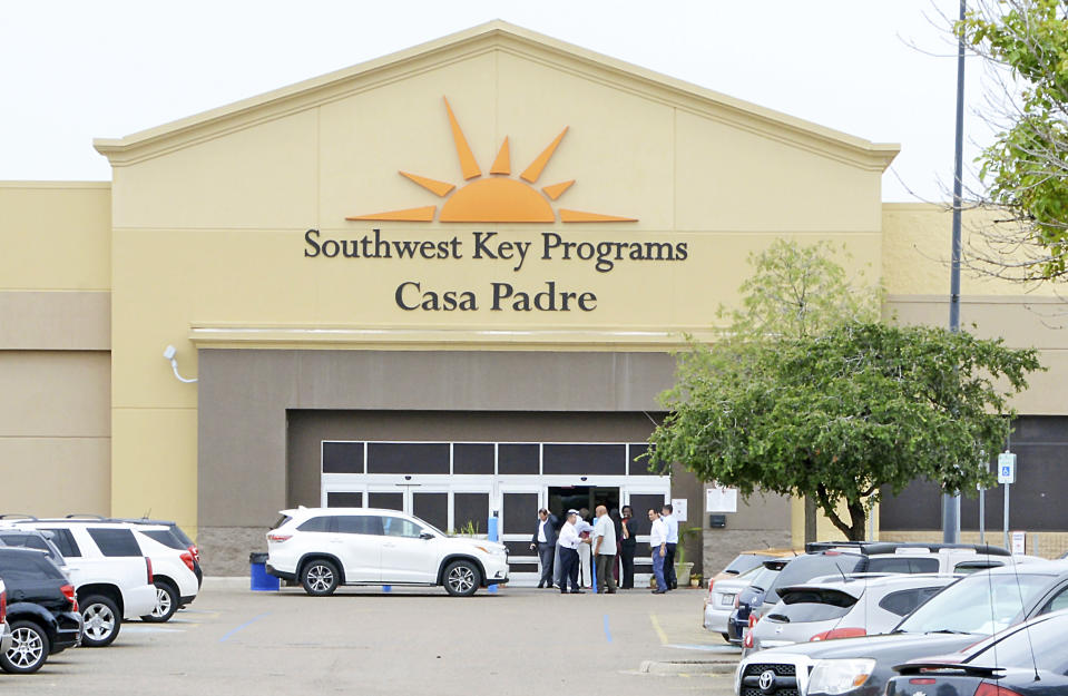 FILE - In this June 18, 2018, file photo, dignitaries take a tour of Southwest Key Programs Casa Padre, a U.S. immigration facility in Brownsville, Texas, where children are detained. When school leaders in San Benito, Texas, learned of an influx of children to a migrant shelter in town, they felt obliged to help. The superintendent reached out and agreed to send 19 bilingual teachers and hundreds of computers to make the learning environment as similar as possible to one of his schools. (Miguel Roberts/The Brownsville Herald via AP, File)