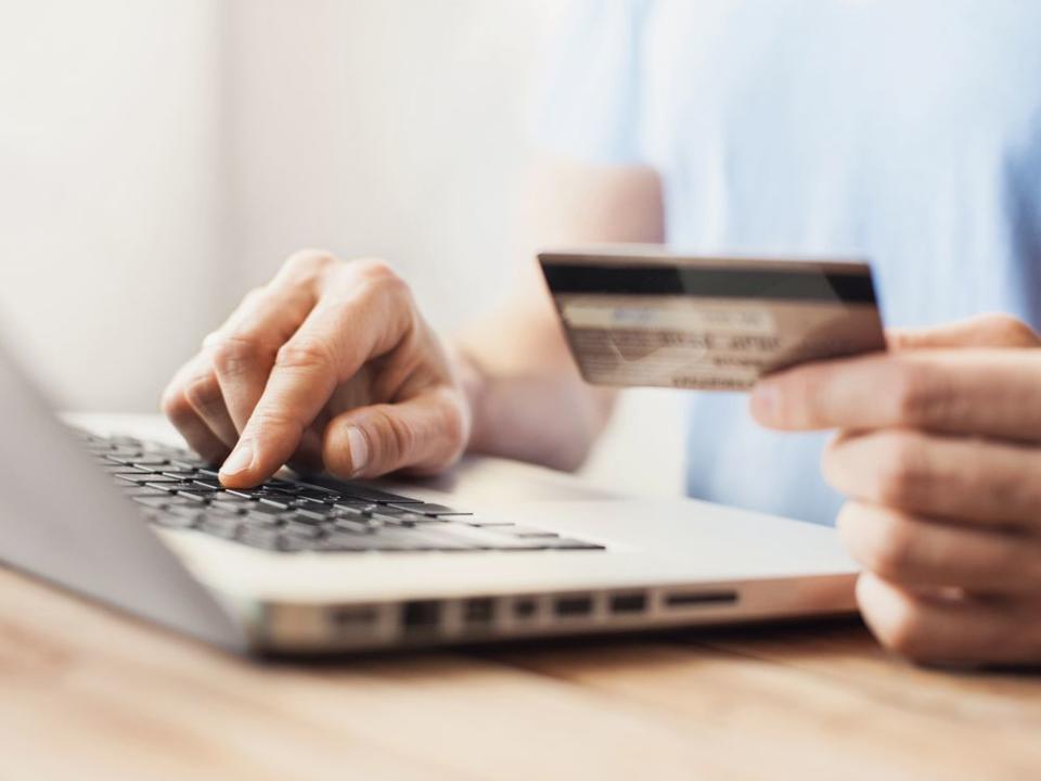 Man is shopping online with laptop