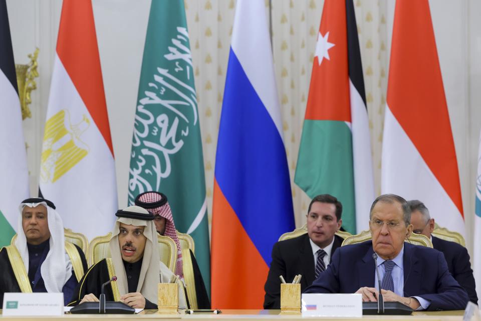 Saudi Arabia's Foreign Minister Prince Faisal bin Farhan Al Saud, left, speaks sitting next to Russian Foreign Minister Sergey Lavrov, right, during a meeting about Gaza, with foreign ministers from members of the Arab League and the Organisation of Islamic Cooperation, amid the ongoing conflict between Israel and the Palestinian Islamist group Hamas, in Moscow, Russia, Tuesday, Nov. 21, 2023. (Evgenia Novozhenina/Pool Photo via AP)