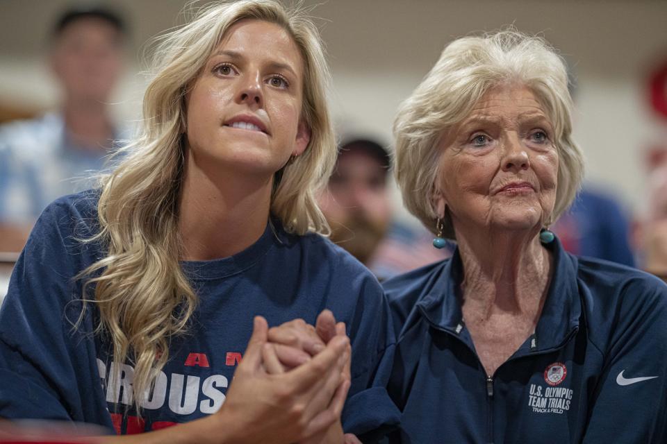 Cousin Haley Crouser, left, and grandmother Marie Crouser, right, watch with friends and family in Redmond, Ore., Wednesday, Aug. 4, 2021, as Ryan Crouser competes in the men's shot put finals at the Tokyo Olympics. (AP Photo/Nathan Howard)