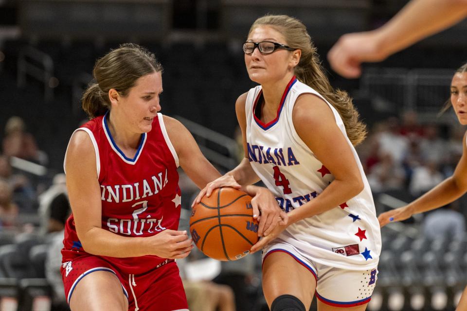 South Future All-Star Emma Haan (2), a junior from Zionsville High School, steals the ball away from North Future All-Star Alli Harness (4), a junior from Carroll (Flora) High School, during the first half of an girlsâ€™ Indiana High School Future All-Stars basketball game, Saturday, June 10, 2023, at Gainbridge Fieldhouse, in Indianapolis.