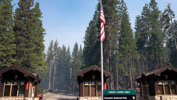 PHOTO: Smoke from the Washburn Fire hangs over the south entrance to Yosemite National Park, California, on July 12, 2022. (Nic Coury/AFP via Getty Images)