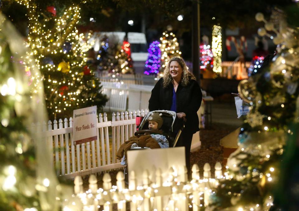 Holidays on the Plaza opened with crowds filling Government Plaza to see the Christmas trees on the Tinsel Trail Monday, Nov. 22, 2021. [Staff Photo/Gary Cosby Jr.]