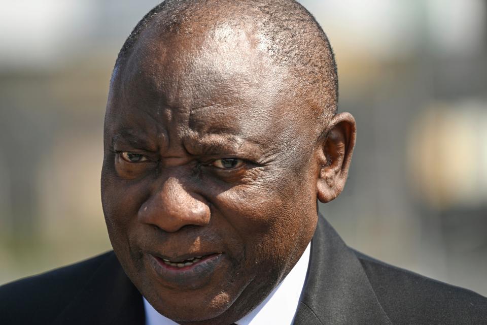 South African President Cyril Ramaphosa walks upon his arrival at the international airport outside St. Petersburg (AP)