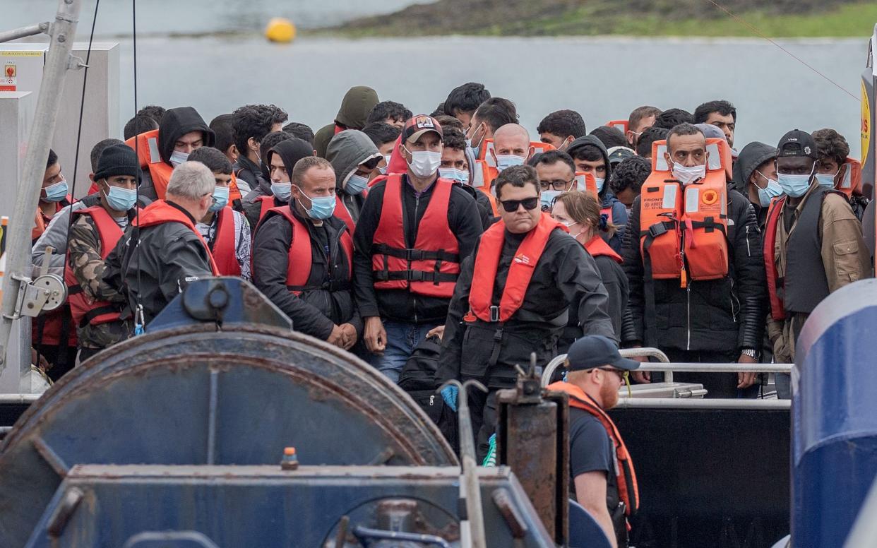 Migrants arrive in the UK after crossing the English Channel from France to Dover in Kent