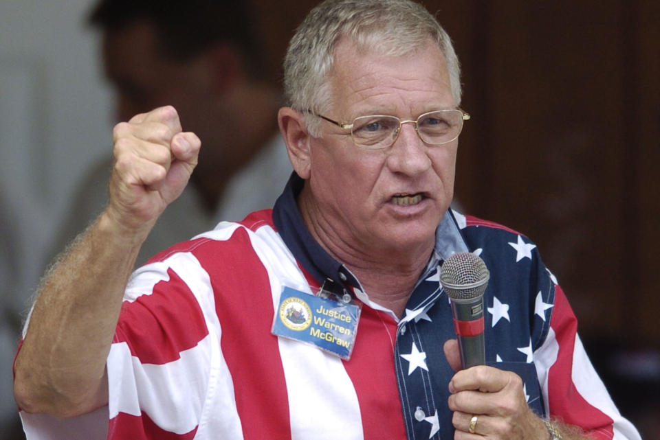 FILE - West Virginia Supreme Court Justice Warren McGraw campaigns for re-election, Sept. 6, 2004, at the UMW Labor Day Picnic in Racine, W.Va. McGraw, a former West Virginia Supreme Court justice who spent five decades in public service, has died at age 84, a Supreme Court spokeswoman said Thursday, June 15, 2023. (AP Photo/Bob Bird, File)