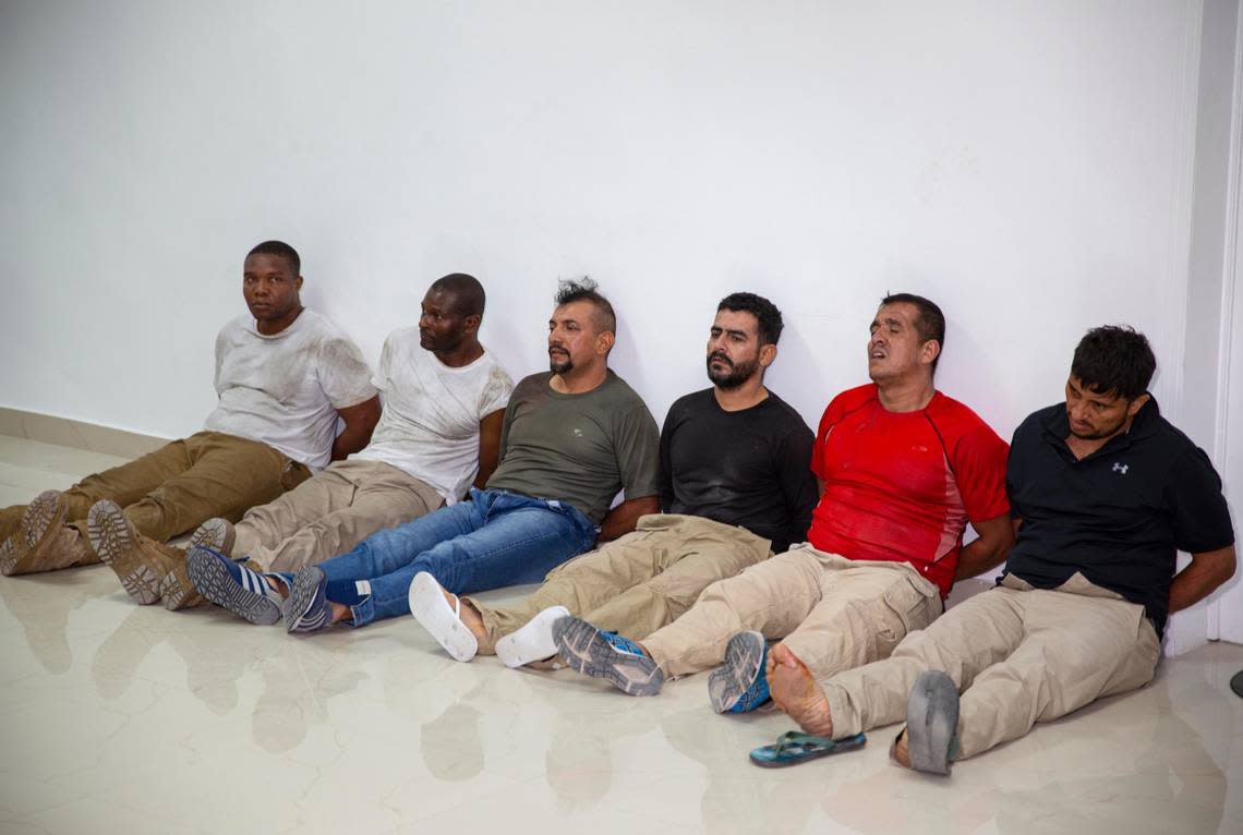 Suspects in the assassination of Haiti’s President Jovenel Moïse, among them Haitian-American citizens James Solages, left, and Joseph Vincent, second left, are shown to the media at the General Direction of the police in Port-au-Prince, Haiti, Thursday, July 8, 2021.