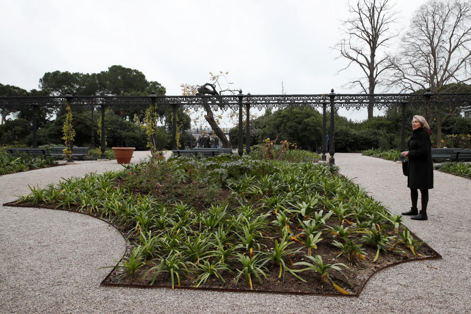 A woman visits the newly restored Royal Gardens in Venice, Italy, Tuesday, Dec. 17, 2019. Venice’s Royal Gardens were first envisioned by Napolean, flourished under Austrian Empress Sisi and were finally opened to the public by the Court of Savoy, until falling into disrepair in recent years. After an extensive restoration, the gardens reopened Tuesday as a symbol both of the lagoon city’s endurance and the necessity of public-private partnerships to care for Italy’s extensive cultural heritage. (AP Photo/Antonio Calanni)
