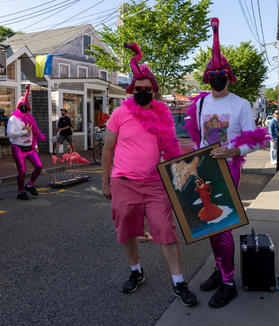 T.J. Baker, left, Derron Palmer, middle, and Steve Pompeo, right, are dressed up as pink flamingos on Thursday at the Provincetown International Film Festival. A 50th anniversary screening of "Pink Flamingos," directed by John Waters, was a feature of the festival.