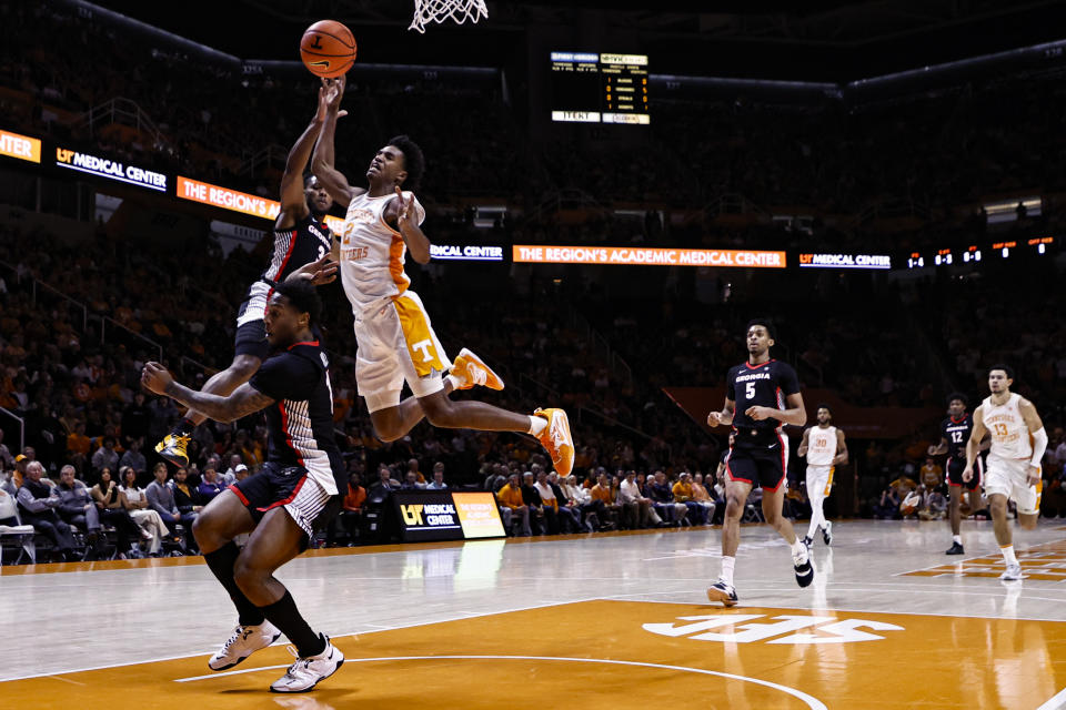 Tennessee forward Julian Phillips (2) is fouled by Georgia guard Kario Oquendo (3) as he goes for a shot during the first half of an NCAA college basketball game Wednesday, Jan. 25, 2023, in Knoxville, Tenn. (AP Photo/Wade Payne)