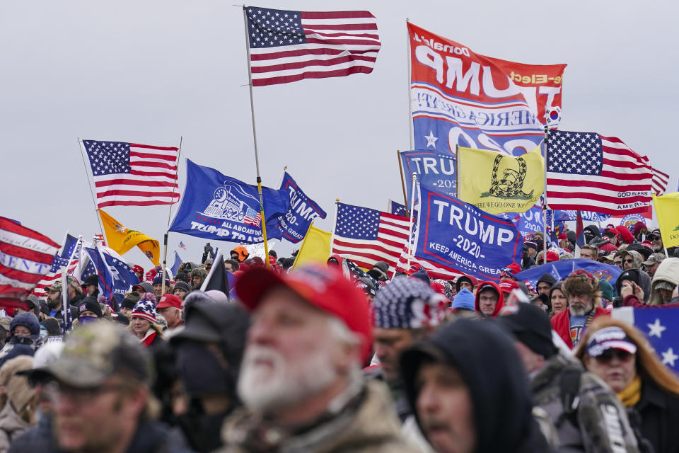 FILE - Trump supporters participate in a rally in Washington, Jan. 6, 2021, that some blame for fueling the attack on the U.S. Capitol. On Thursday, Feb. 8, the nation's highest court is scheduled to hear arguments in a case involving Section 3 of the 14th Amendment, which prohibits those who “engaged in insurrection or rebellion” from holding office. The case arises from a decision in Colorado, where that state's Supreme Court ruled that Trump violated Section 3 of the 14th Amendment and should be banned from ballot. (AP Photo/John Minchillo, File)