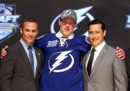 PITTSBURGH, PA - JUNE 22: Slater Koekkoek (C), tenth overall pick by the Tampa Bay Lightning, poses on stage with general manager Steve Yzerman (L) and team representatives during Round One of the 2012 NHL Entry Draft at Consol Energy Center on June 22, 2012 in Pittsburgh, Pennsylvania. (Photo by Bruce Bennett/Getty Images)