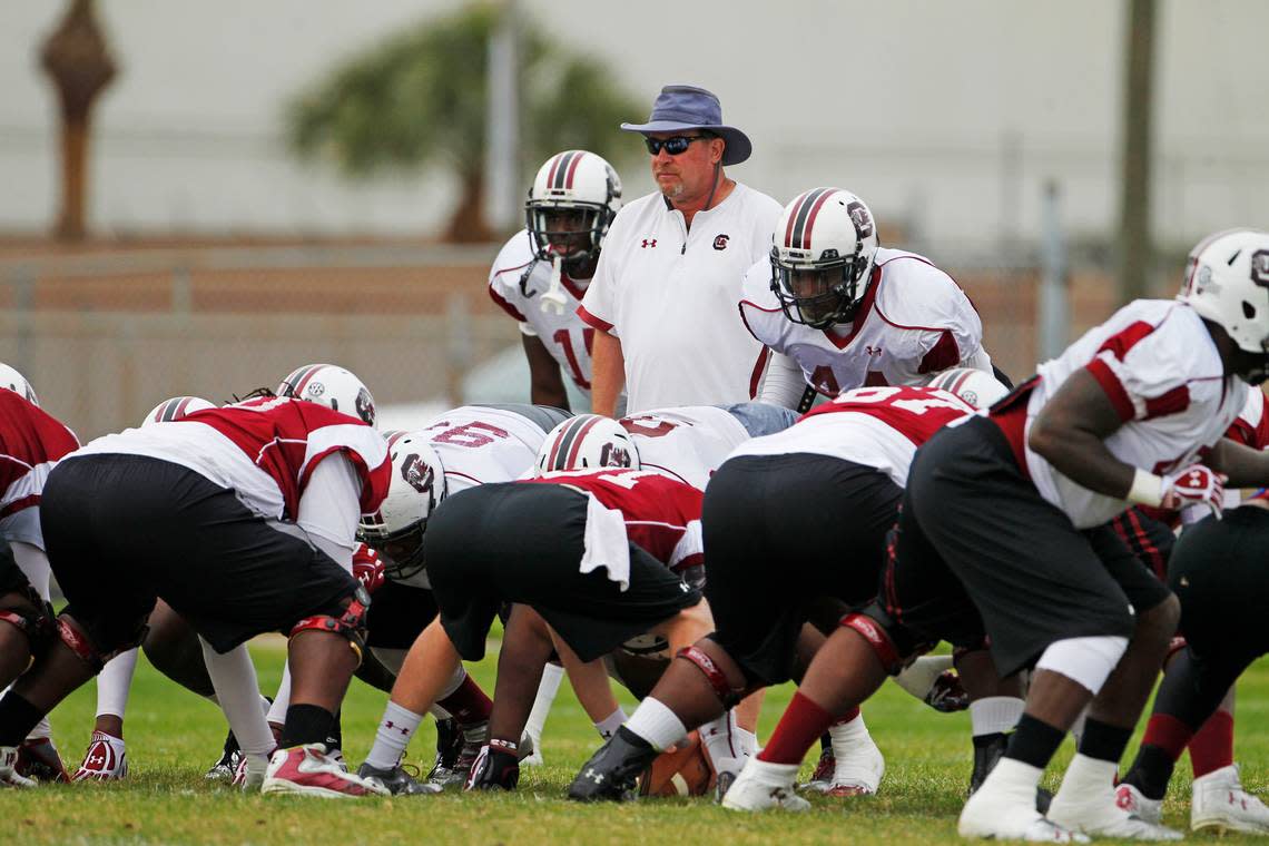 South Carolina defensive line coach Brad Lawing watches a drill during practice at Jefferson High School in Tampa.