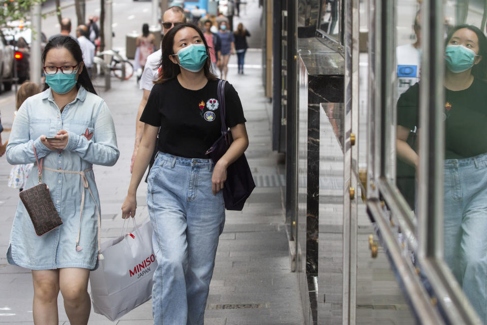 SYDNEY, AUSTRALIA - DECEMBER 21: People are seen walking along Market Street in Sydney's CBD on December 21, 2020 in Sydney, Australia. Sydney's northern beaches is on lockdown, as a cluster of Covid-19 cases continues to grow causing other Australian states and territories to impose restrictions on travel ahead of the Christmas holidays. As the list of venues impacted across Sydney increases, people are encouraged to get tested and isolate. (Photo by Jenny Evans/Getty Images)