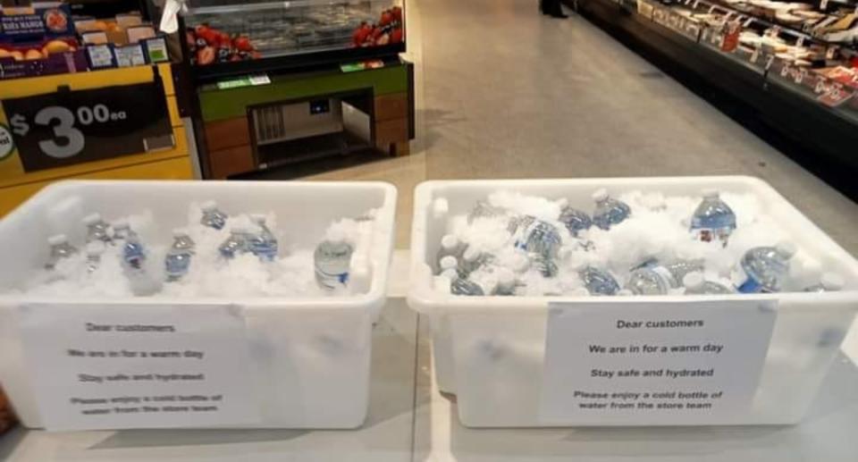 Tubs of ice and free water bottles at Woolworths store