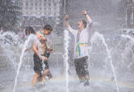 <p>Ukrainian students fool around in a fountain as they celebrate the end of their school term on Independence Square in downtown Kiev, Ukraine, on May 27, 2016. (Roman Pilipey/EPA) </p>