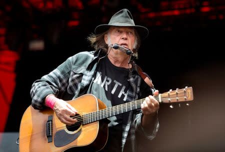 Canadian singer-songwriter Neil Young performs at the Orange Stage at the Roskilde Festival in Roskilde, Denmark, July 1, 2016. Picture taken July 1, 2016. Scanpix Denmark/Nils Meilvang/via REUTERS