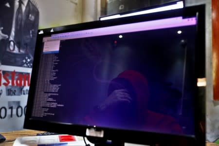 A man is reflected in a monitor as he takes part in a training session at Cybergym, a cyber-warfare training facility backed by the Israel Electric Corporation, at their training center in Hadera, Israel