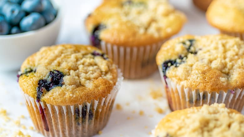 blueberry muffins in paper wrappers