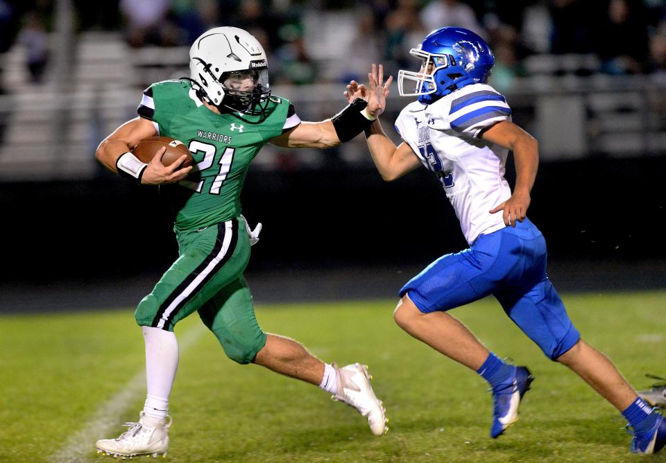 Athens High School's Camren Bigard stiff arms Auburn's Stephen Emerson as Bigard runs for a touchdown during the game Friday, Sept. 15, 2023.