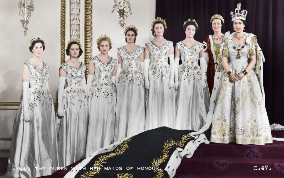 <p>Queen Elizabeth II with her maids of honour, in the green drawing room of Buckingham Palace, on June 2, 1953. By artist Cecil Beaton (photo by the print collector/Getty images)</p>