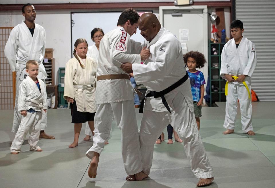 Sensei Earl Wright watches over his students as they practice thier technique during a workout at the Elyson Industrial Park DoJo on Friday, June 10, 2022. 