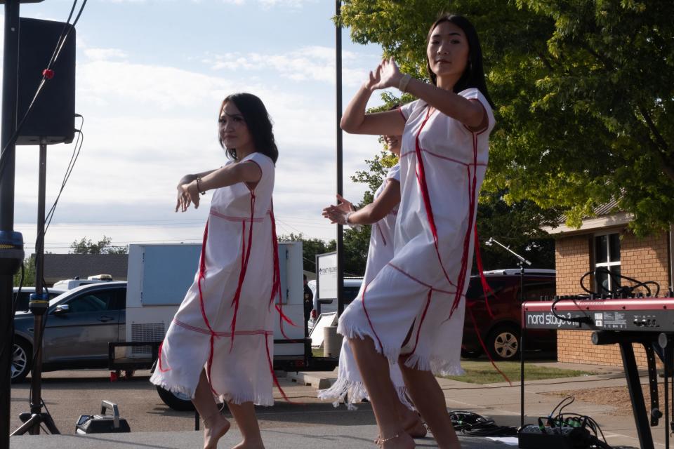 Dancers from Karen show the crowd one of their cultural dances Sunday at Trinity Fellowship in the Eastridge neighborhood of Amarillo.