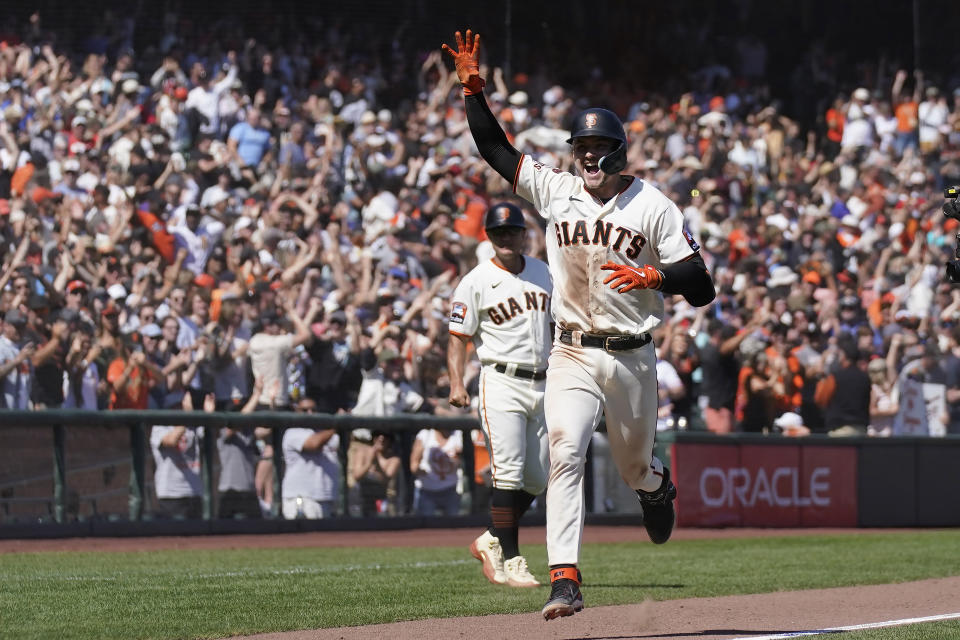 San Francisco Giants' Patrick Bailey celebrates after hitting a two-run home run during the tenth inning of a baseball game against the Texas Rangers in San Francisco, Sunday, Aug. 13, 2023. (AP Photo/Jeff Chiu)
