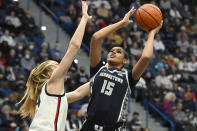 Georgetown's Brianna Scott (15) shoots over UConn's Dorka Juhasz in the first half of an NCAA college basketball game, Sunday, Jan. 15, 2023, in Hartford, Conn. (AP Photo/Jessica Hill)