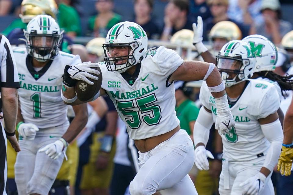 Marshall defensive lineman Owen Porter (55) celebrates an interception against Notre Dame during the second half in South Bend, Indiana, on Sept. 10, 2022. Marshall defeated Notre Dame 26-21.
