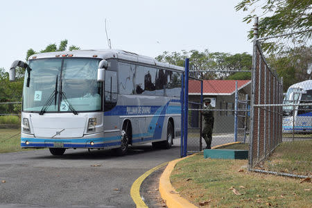 Cuban citizens arrive on buses to board a Federal Police airplane bound for La Havana, Cuba, after being deported from Mexico, at the international airport in Tapachula, Mexico January 20, 2017. REUTERS/Jose Torres