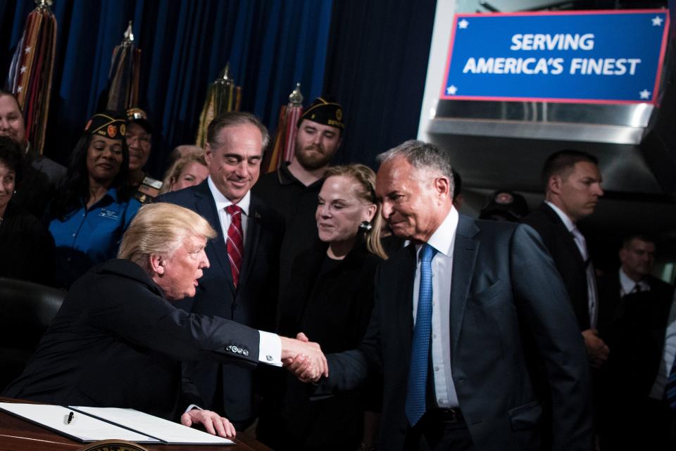 US President Donald Trump shakes Ike Perlmutter, CEO of Marvel Entertainment - Credit: BRENDAN SMIALOWSKI/AFP via Getty Images)