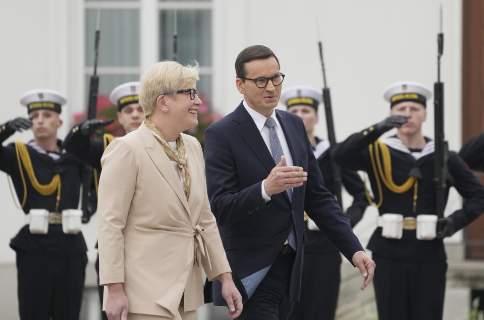 Lithuanian Prime Minister Ingrida Simonyte, left, being greeted by Poland's Prime Minister Mateusz Morawiecki on a visit for talks that include the region's security in the face of migrant pressure on the two countries' borders with Belarus, in Warsaw, Poland, on Friday, Sept. 17, 2021. (AP Photo/Czarek Sokolowski)