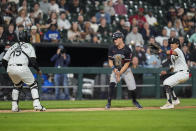 Minnesota Twins right fielder Max Kepler, center, gets caught between bases by Chicago White Sox catcher Martín Maldonado, left, and third baseman Nicky Lopez during the sixth inning of a baseball game Tuesday, April 30, 2024, in Chicago. (AP Photo/Erin Hooley)