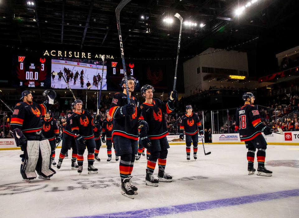 Coachella Valley Firebirds players celebrate winning Game 4 of the Pacific Division semifinals to end the series at Acrisure Arena in Palm Desert, Calif., Friday, May 10, 2024.