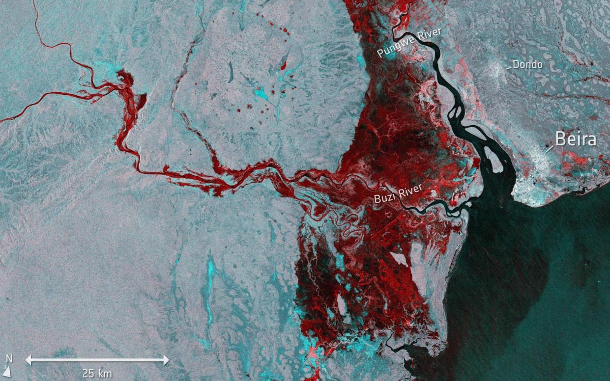 A satellite image from the ESA shows the extent of flooding, depicted in red, around the port town of Beira in Mozambique on March 19, 2019 as tropical cyclone Idai cut a swathe through Mozambique, Zimbabwe and Malawi - AFP